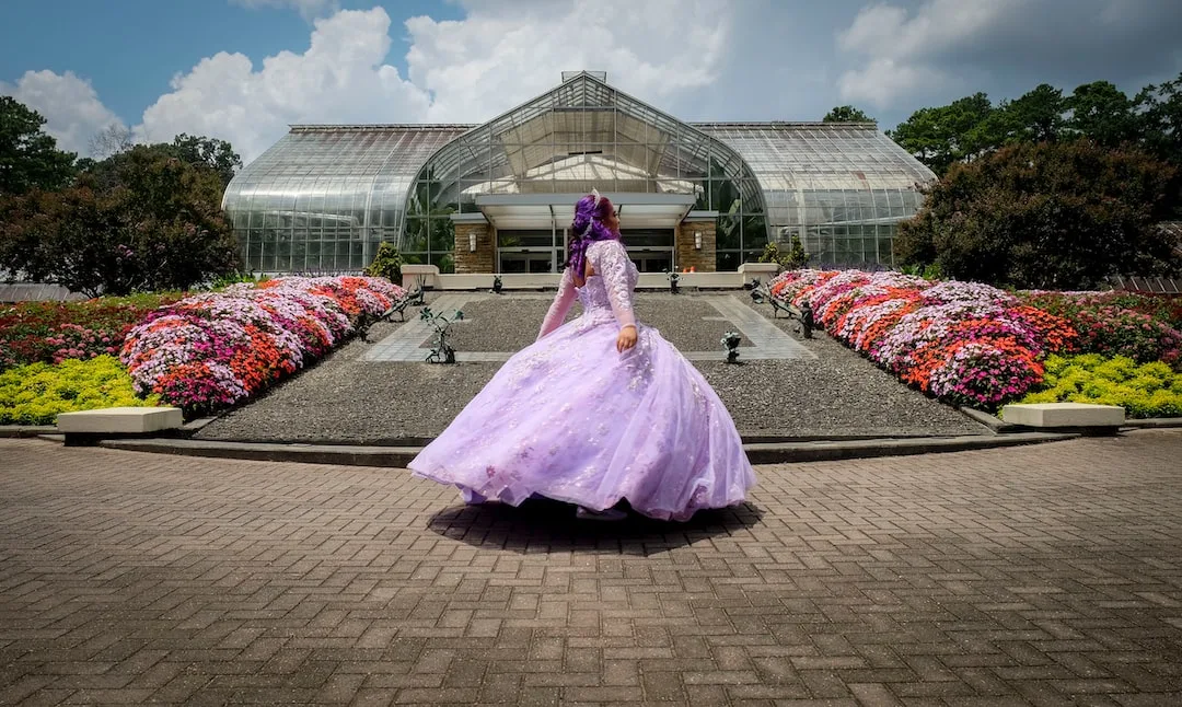 Lavender ballgown twirling in a flowering greenhouse