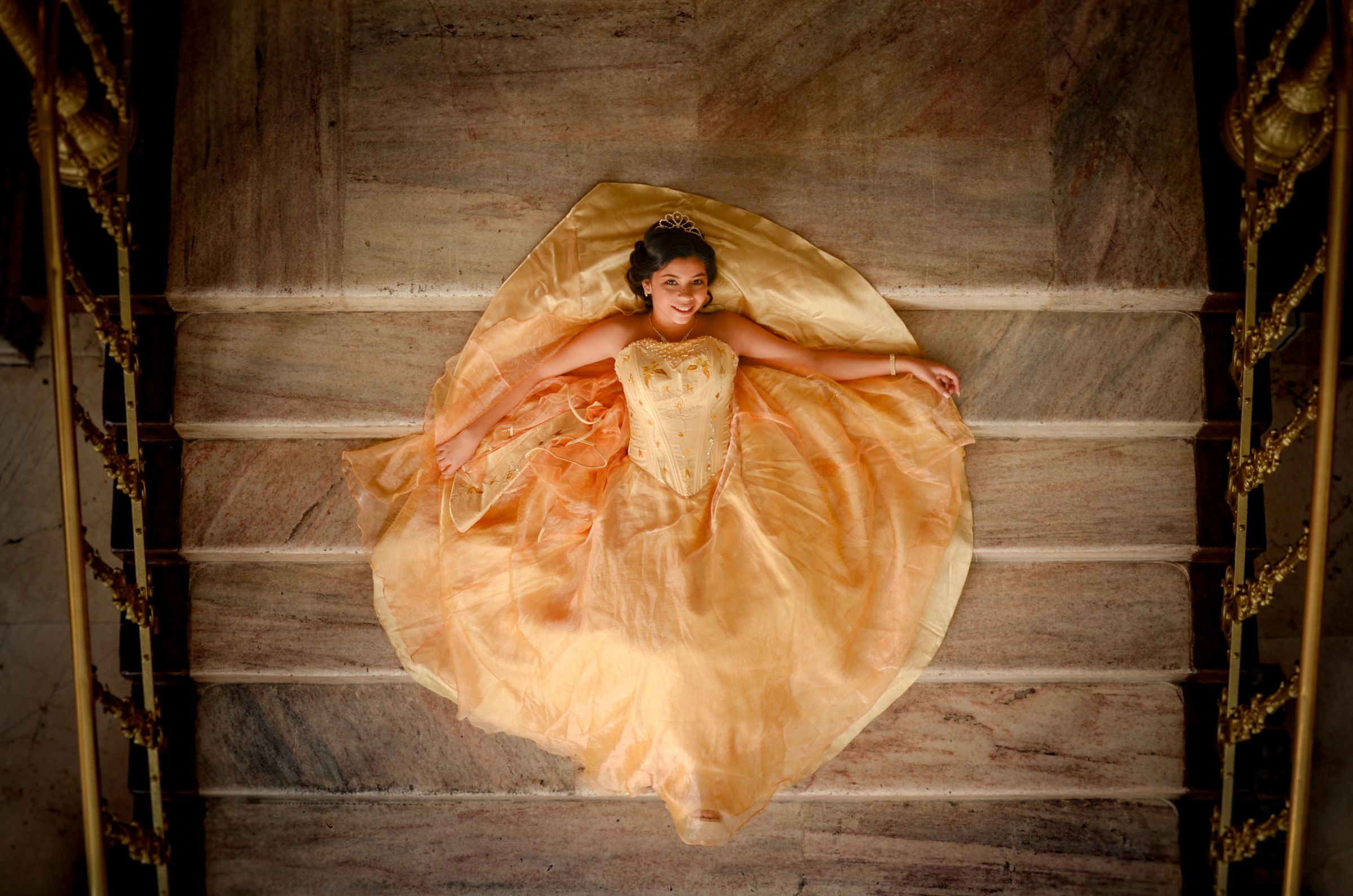 Quinceañera in orange gown (Unsplash · @anelale)
